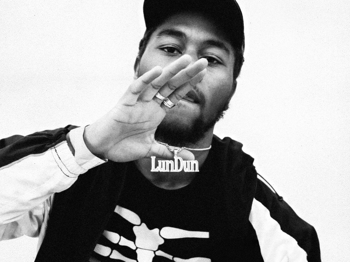 Candid & Directed — black and white portrait of Clint419 with LunDun chain
