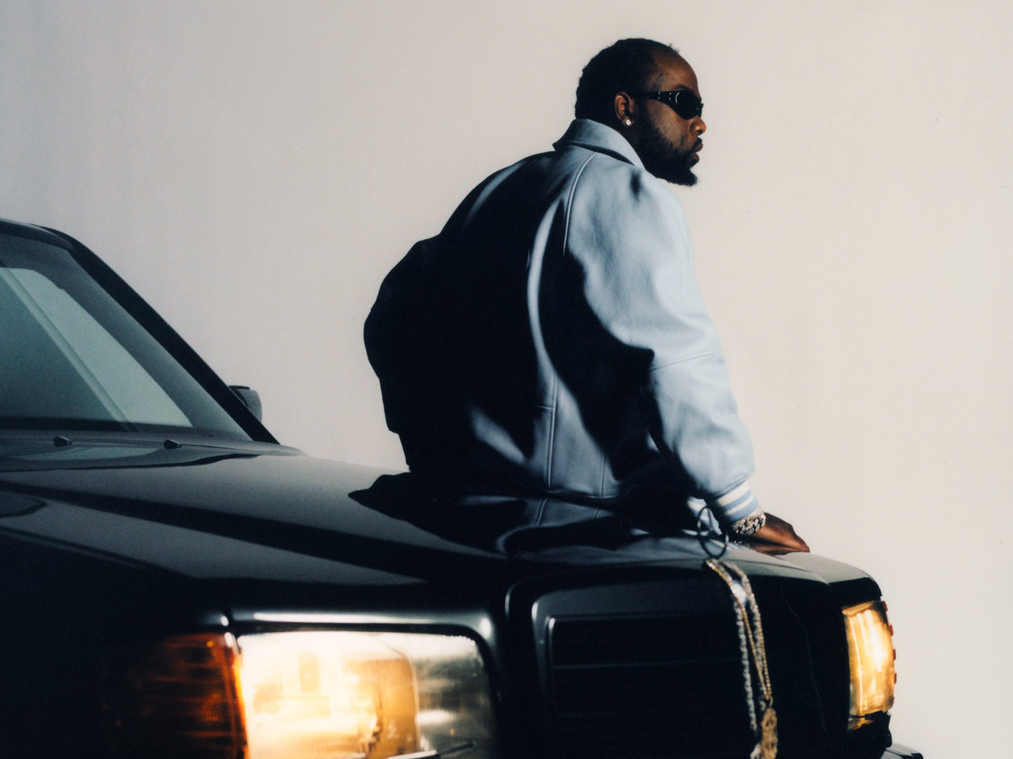 Conway The Machine seated on a Mercedes, Deeds Magazine