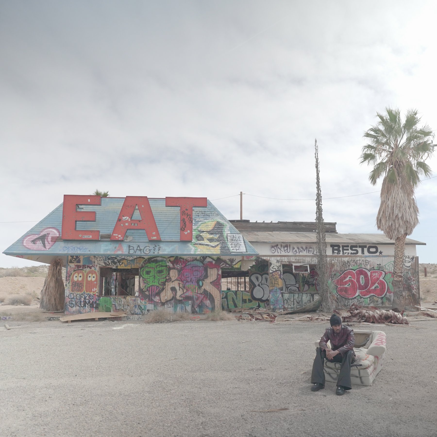 Original photograph — the diner with its EAT sign, before compositing and grade