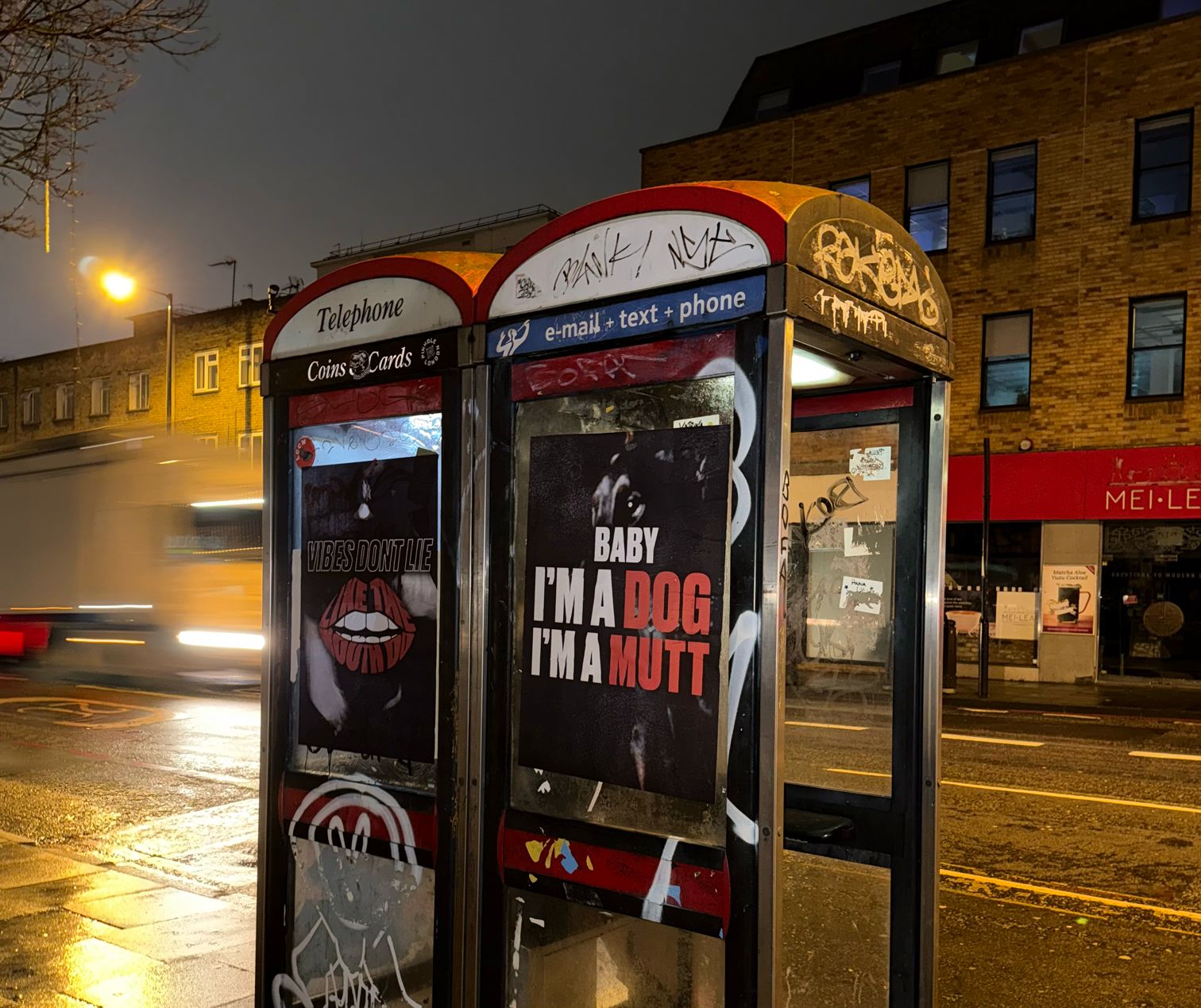 Mutt flyposters on a Camden phone box — Vibes Don&rsquo;t Lie and Baby I&rsquo;m A Dog, I&rsquo;m A Mutt